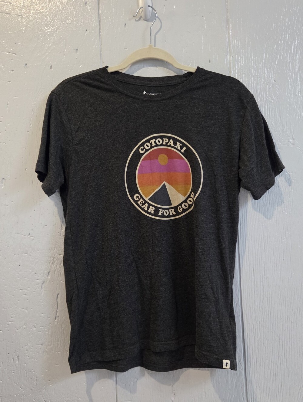 cotopaxi Charcoal Tee with Pink Orange Yellow Sunset Logo